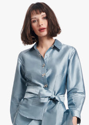 TAFFETA BLOUSE WITH CRYSTAL BOW BUTTONS AND SASH LIGHT BLUE