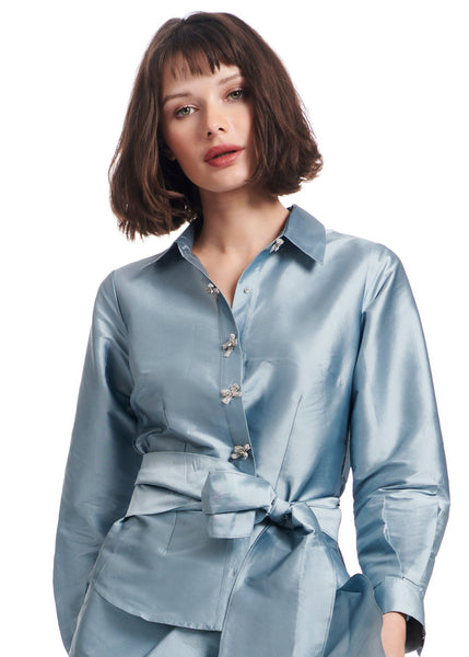 TAFFETA BLOUSE WITH CRYSTAL BOW BUTTONS AND SASH LIGHT BLUE The
